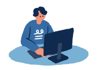 デスクでパソコンを操作する男性のイラスト